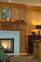 The Oxford mantel surrounds our Hampton Court Limestone mantel in this image