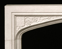 Floral details and a Coat of Arms add to this Hampton Court surround