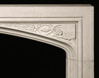The Hampton Court Limestone Mantel has a classic Tudor arch
