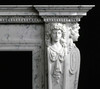 The marble mantel with Italian design, includes crown above detailed dentil molding