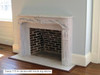 The Savoy marble mantel shown with optional Inside Returns. Carrara.