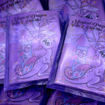 Cute cartoon dragon themed filled arty bag for children’s birthday parties wrapped in coloured cello