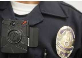 Image of a police officers chest showing Taser Axon Body Cam in use