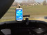 Samsung phone mounted to golf cart dash.
