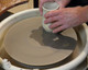The disc attaches to the potter's wheel with the included bat.