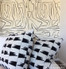 A great way to incorporate expensive luxury fabrics for high visual impact but low budget impact is with toss pillows.  