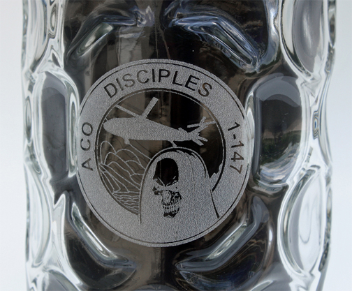 Custom logo engraving on dimpled glass mug