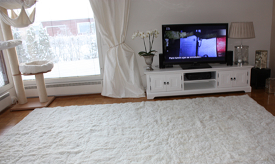 Custom white alpaca rug in living room front view