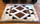 Modern Aztec Pattern Alpaca Rug on wood floor.