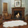 Quarto (4-pelt) Longwool Ivory Sheepskin Rug in Front of Fireplace