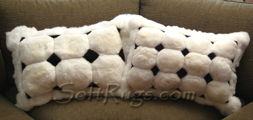 Two White Puffs With Black Diamond Accents Alpaca pillow. 