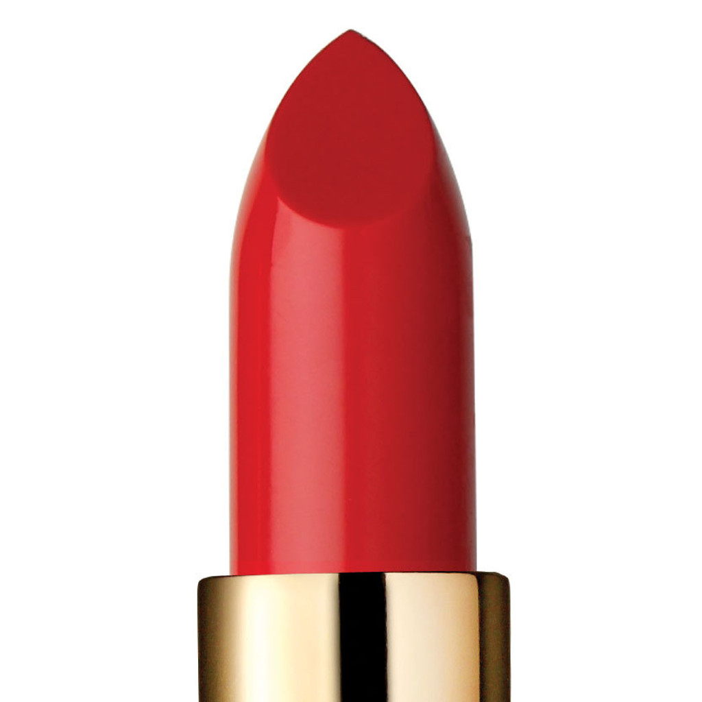 Closeup of vintage red lipstick and top of gold tube