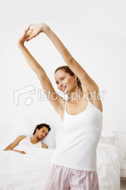 stock-photo-12574677-happy-lazy-woman-with-a-man-sleeping-in-bed.jpg
