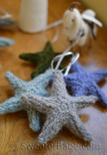 puffy stars - grey in front, green middle, periwinkle in back