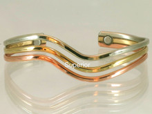 The Wave magnetic copper bracelet is Inspired by the sea, this fluid design was handcrafted to comfortably embrace the wrist bone. This a good design to add movement to a group of thin bracelets and is a favorite to wear on the left with a wrist watch.