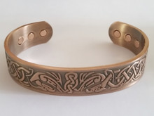 The Celtic Bird copper bracelet for men has a beautiful embossed celtic design