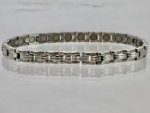 This stainless steel magnetic bracelet  has 5/16" wide x 3/8" long links with 23  N52 5200 Gauss rare earth magnets in an 10 1/2" length.  It has a magnetic therapy pull strength of 930 grams.