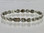 This anklet has a 5/16" wide x 7/16" long link with 18 rare earth magnets in 8 9/16" length. It has a magnetic therapy pull strength of 930 grams.