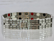 This stainless steel mineral & magnet bracelet has a 9/16" wide x 3/8" long link with 38 alternating pieces of Neodymium magnets, Germanium, Infra-Red and Anion negative ion in an 8 5/8" length