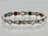 This stainless steel mineral & magnet bracelet has 5/16" wide x 1/2" long links with 14 alternating pieces of Neodymium magnets, Germanium, Infra-Red and Anion negative ion in a 73/4"