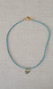 Turquoise Beaded Necklace with Heart Pendant
Handmade Item
Length: 16" + 2" Extender
Materials : Turquoise Beads, 
Brass Pendant
Closure : Gold Filled Lobster Clasp