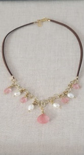 Leather Choker Necklace with Rose Quartz Pendant
Handmade Item
Length : 14 1/2 "
Materials : Leather Cord, Gold Filled
Brass Chain, Rose Quartz Beads, Fresh
Water Pearls
Closure : Gold Filled Lobster Clasp