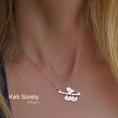 mother nestling birds necklace