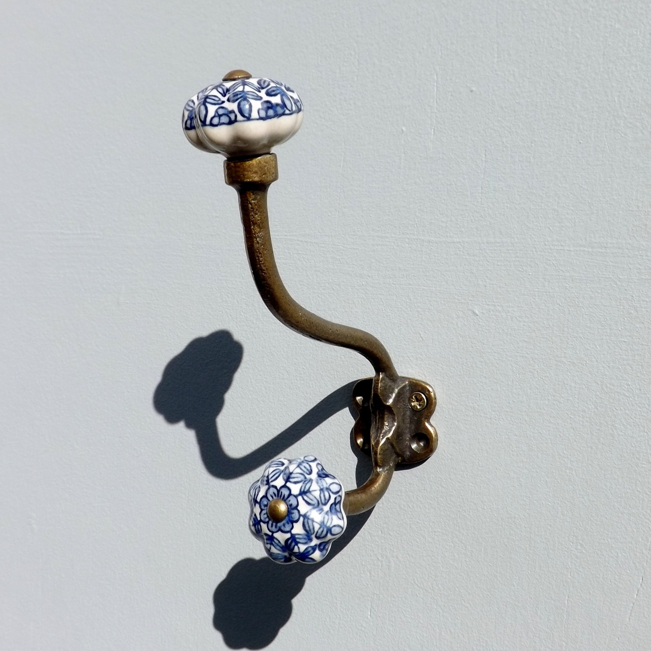 lovehooks.co.uk antique brass effect double coat hook with ceramic knobs