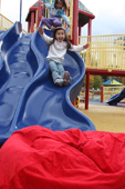 Kid sliding into bean bag chair