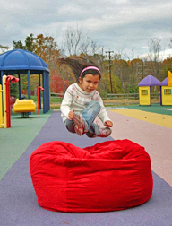 Kid jumping in bean bag