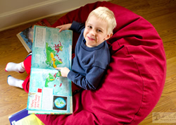 Boy in red denim bean bag chair