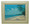 A framed tile with a painting of the west coast of Barbados by Sue Trew