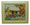 A framed tile with a painting of a rum shop in Barbados by Jill Walker