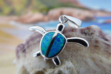 Turtle pendant made of sterling silver and blue opal.
