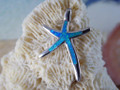 Starfish pendant made of sterling silver and blue opal. 