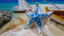 Starfish pendant made of sterling silver and blue opal. 