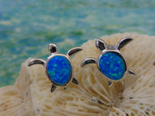Turtle stud earrings made of sterling silver and blue opal.
