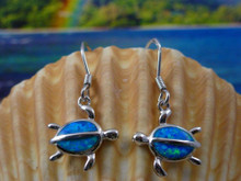 Turtle earrings made of sterling silver and blue opal. 