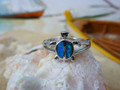 Turtle ring made of sterling silver and blue opal.