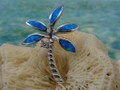 Palm pendant made of sterling silver and blue opal. 