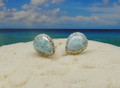 Larimar and silver stud earring with a twisted edge.