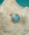 A larimar and silver pendant.