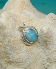 A larimar and silver pendant.