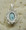 Rear view of larimar and silver pendant.