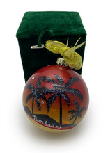 A glass Christmas Ball hand painted all around.