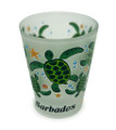 Green turtles on a frosted shot glass