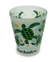Green turtles on a frosted shot glass