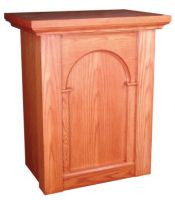 Light-colored wooden tabernacle stand with a square design.
