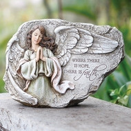 Plaque featuring a brunette angel praying with saying.