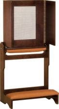 A large square board with panels on each side sits atop wooden legs with a padded place to kneel in front of the board.